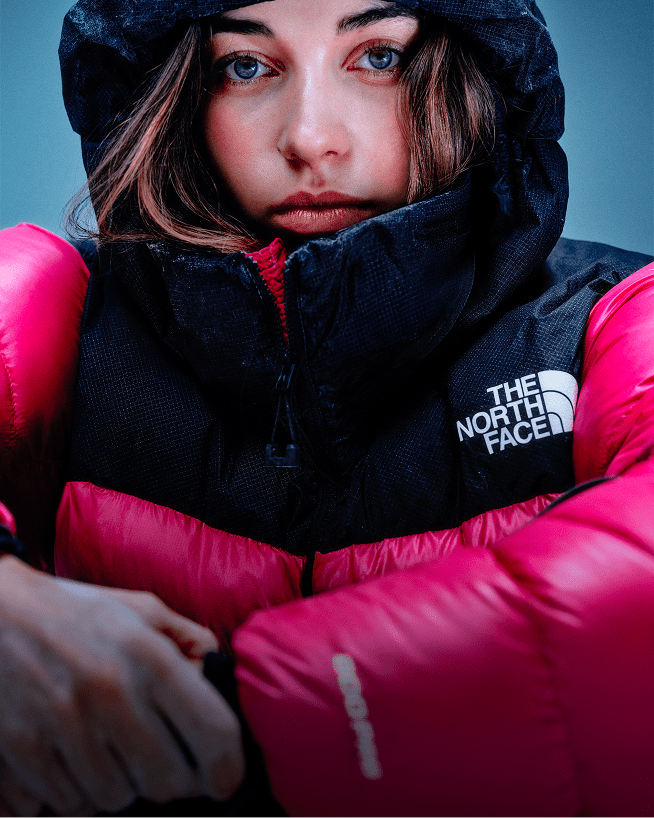 A closeup shot of a Nuptse jacket clearly showing The North Face logo. 