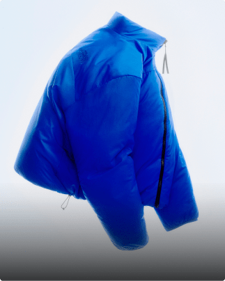 A blue Pertext Nuptse in its reversible form is suspended in air with a white background.