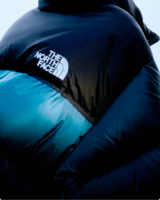 Closeup of a teal 1996 Retro Nuptse jacket.