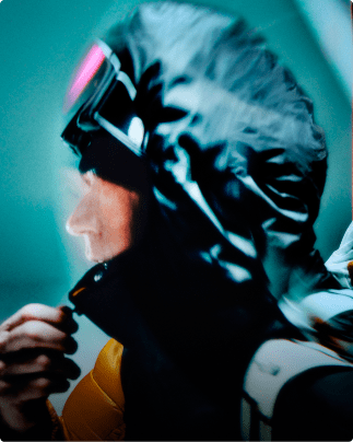 A profile shot of Jim Morrison with the insulated hood pulled up on his Summit Nuptse jacket.