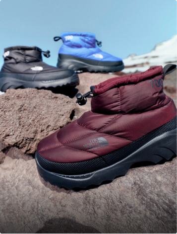 A picture of shoes on a rock.