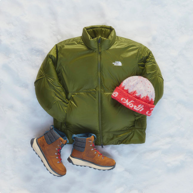 A bundle of men's products including a green jacket, a white and red wool beanie, and tan winter boots