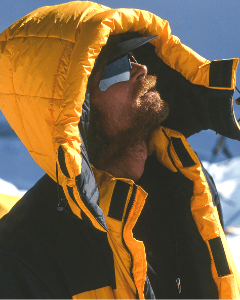man hiking in a crevase