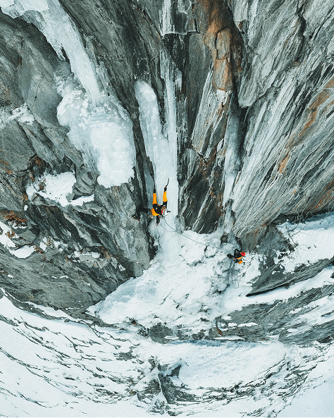 man hiking in a crevase