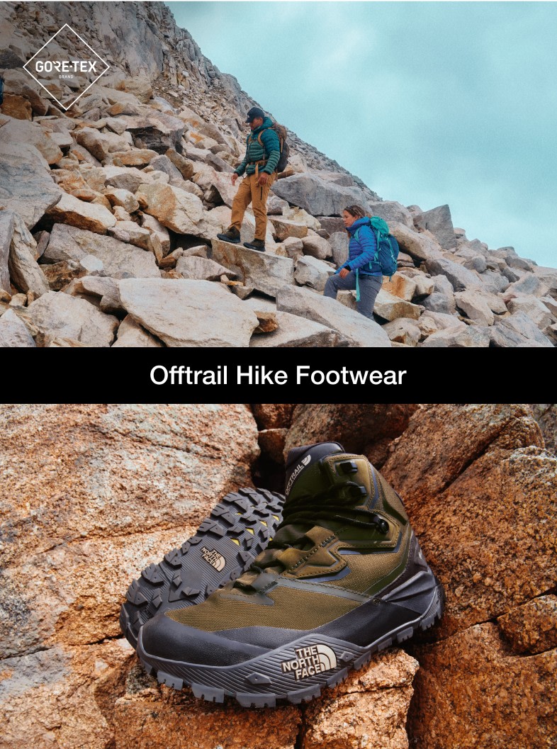 Brown and black hiking boots sitting atop of rocks in the image to the left. A man in a green puffy and brown pants leading the way up a scramble. A woman in a blue jacket and gray pants is behind him. 