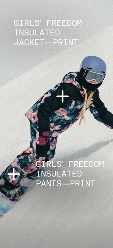 Child skiing down a mountain wearing Freedom Triclimate and Freedom Insulated bibs.