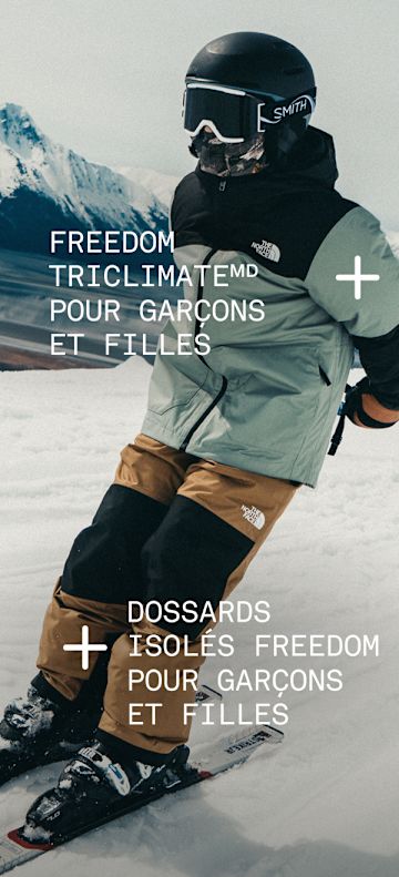 Child skiing down a mountain wearing Freedom Triclimate and Freedom Insulated bibs.