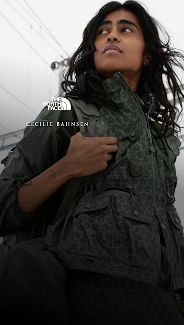 Model wearing The North Face x Cecilie Bahnsen Tenzin Convertible Jacket with utility pockets and convertible design.