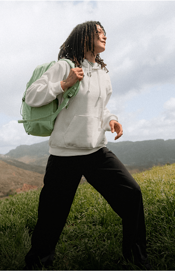 Woman in a white sweatshirt running