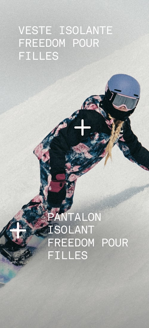 Child skiing down a mountain wearing Freedom Triclimate and Freedom Insulated bibs.