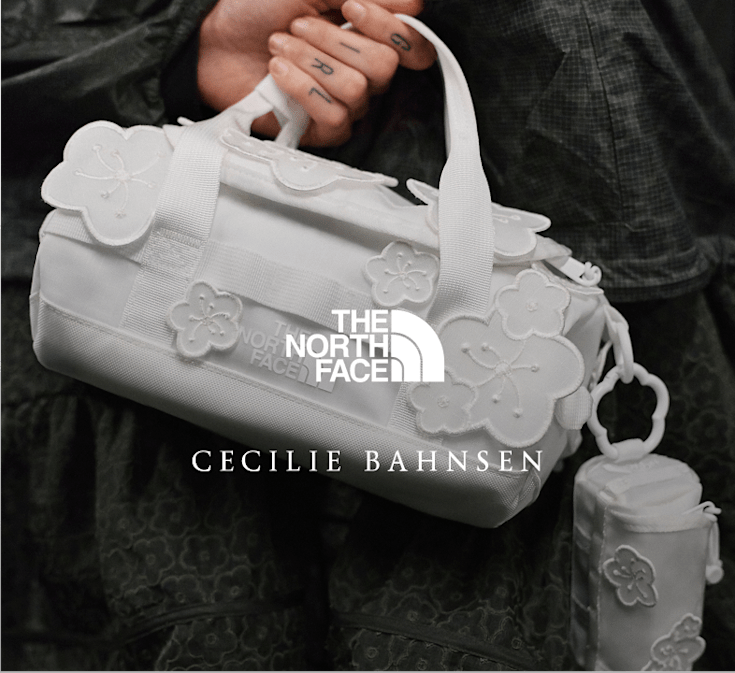 A model holding a Anna Base Camp Duffel bag featured in The North Face x Cecilie Bahnsen collection
