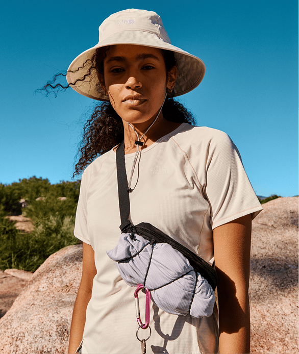 A woman wearing a brimmer hat from The North Face.