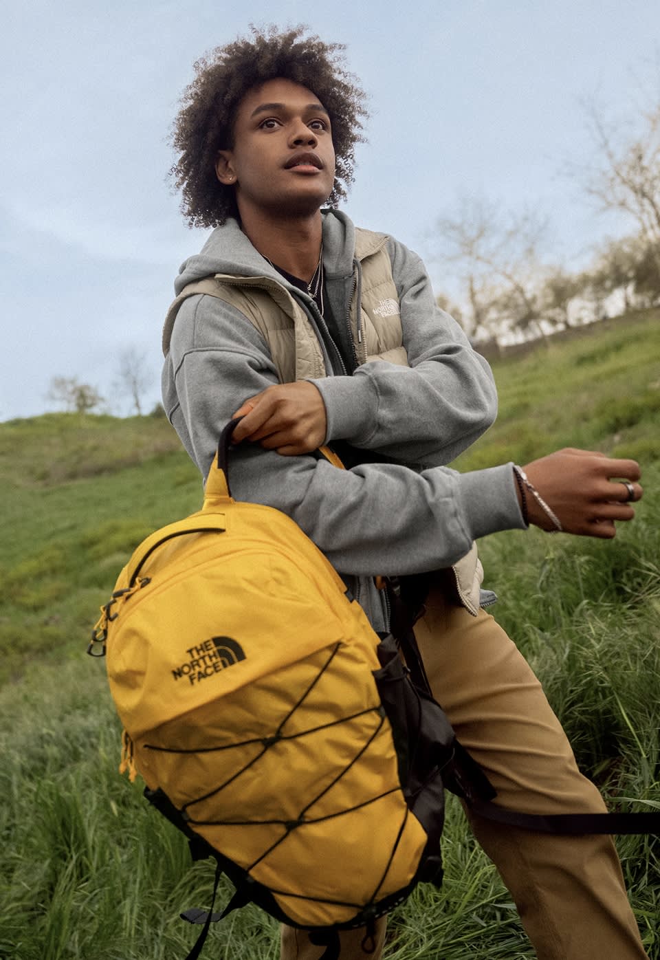 Man carrying a yellow Borealis backpack