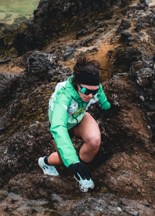 Image of a climber from The North Face scaling an ice wall.