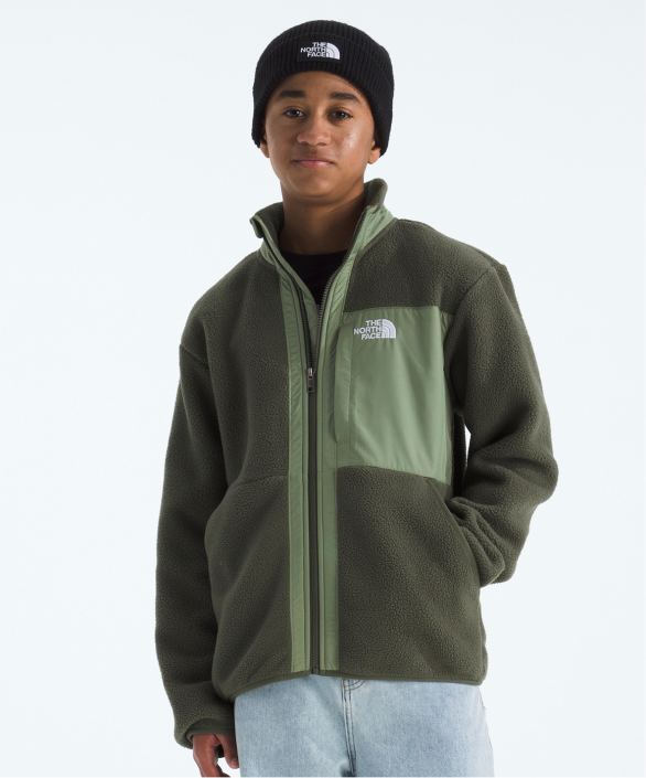 A young boy wearing a rain jacekt from The North Face.