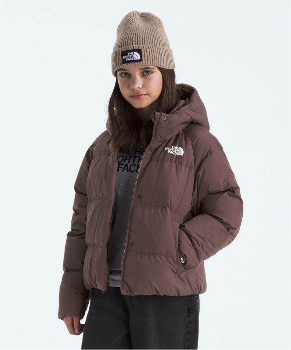 A young girl wearing a rain jacket from The North Face