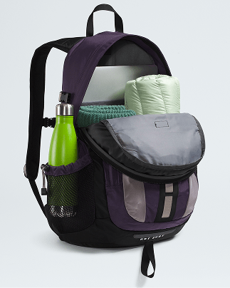  A purple backpack is open, showing how it can fit a coat, sweater, larger laptop and water bottle.