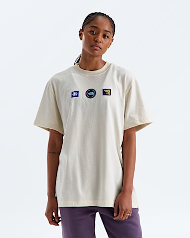 Unisex Explorer Badges Relaxed ShortSleeve TeeGraphic TNF White Dune HERO3